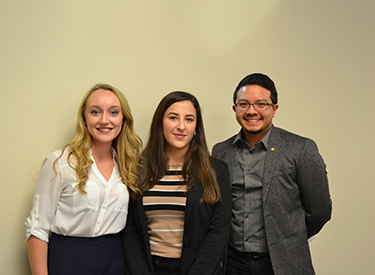 Alex Friesen (left) stands with fellow business students. Alex Friesen (left) stands with fellow business students.